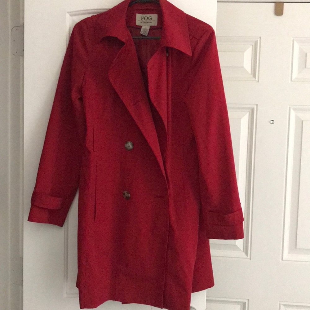 Red long double breasted trench coat, with belt.